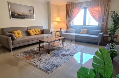 Living Room image for: Apartment - 1 Bedroom - 2 Bathrooms for sale in Tower 28 - Porto Arabia - The Pearl Island - Doha, Image 1