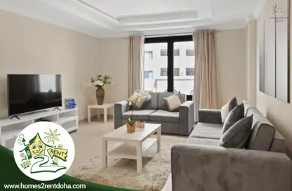 Living Room image for: Apartment - 1 Bedroom - 2 Bathrooms for rent in Tower 19 - Porto Arabia - The Pearl Island - Doha, Image 1