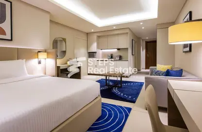 Room / Bedroom image for: Apartment - 1 Bathroom for rent in Al Shatt Street - West Bay - Doha, Image 1