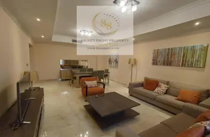 Living / Dining Room image for: Apartment - 2 Bedrooms - 2 Bathrooms for rent in Ghanem Business Centre - Fereej Bin Mahmoud South - Fereej Bin Mahmoud - Doha, Image 1